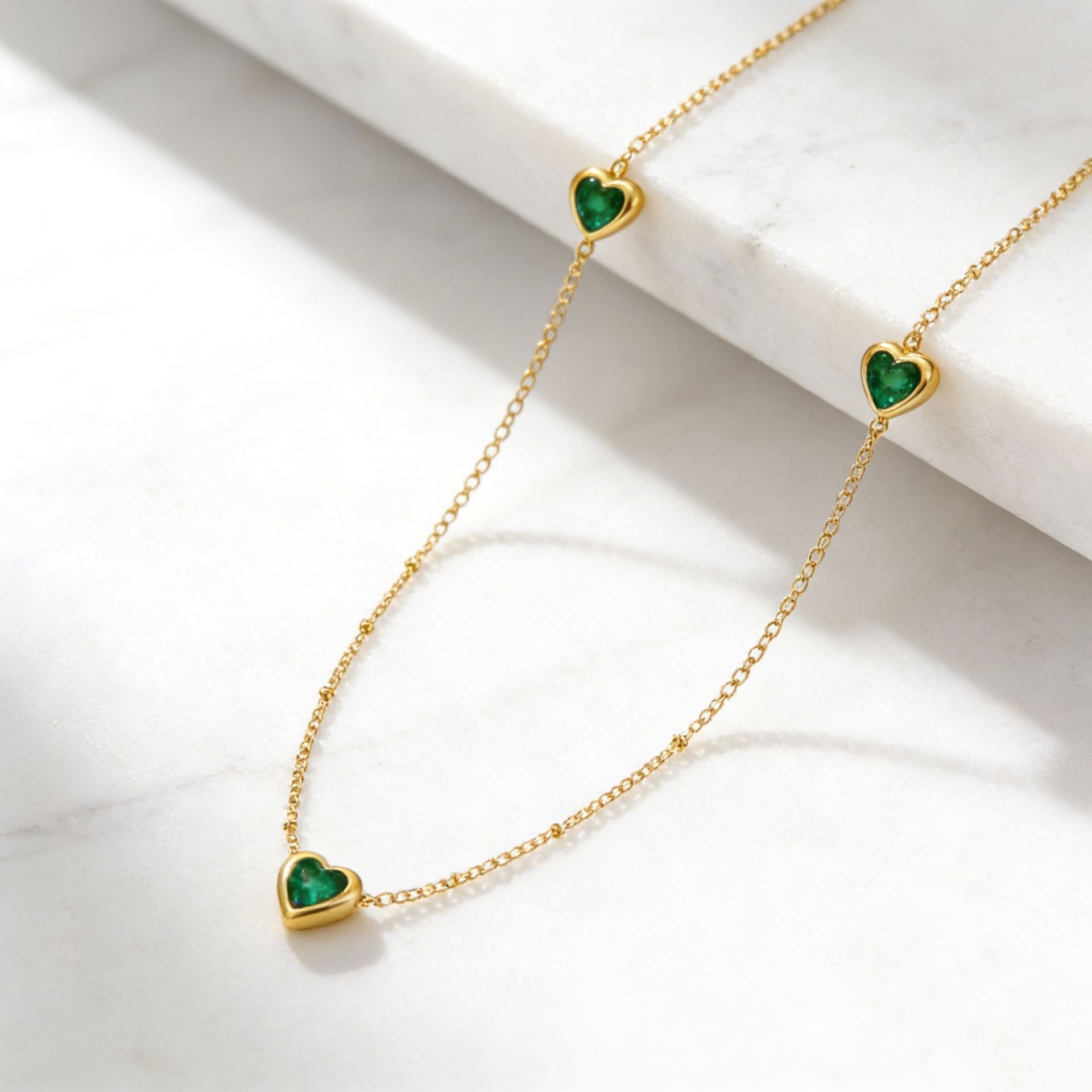 K Stainless Steel Necklace And Bracelet With Inlaid Green Diamond Hearts
